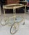 Exceptional brass bar cart. Impress your guests with this sleek brass bar cart with holders for three bottles of your...