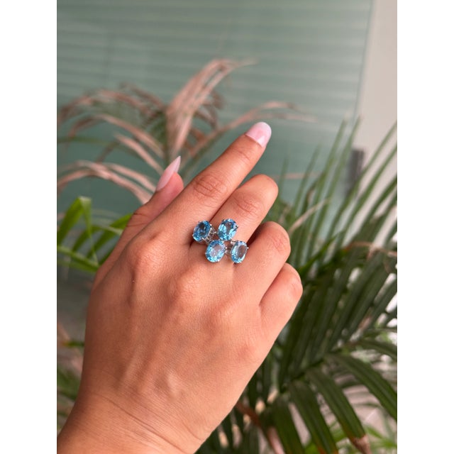 This exquisite Mid-Century Modern–inspired four-stone cocktail ring is finely crafted in 925 Sterling Silver and set with...