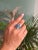 This exquisite Mid-Century Modern–inspired four-stone cocktail ring is finely crafted in 925 Sterling Silver and set with...