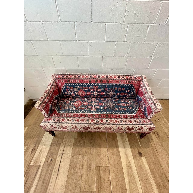 The furniture item in the image is the Rug-Printed Petite Anatolia Sofa from Anthropologie. Inspired by traditional...