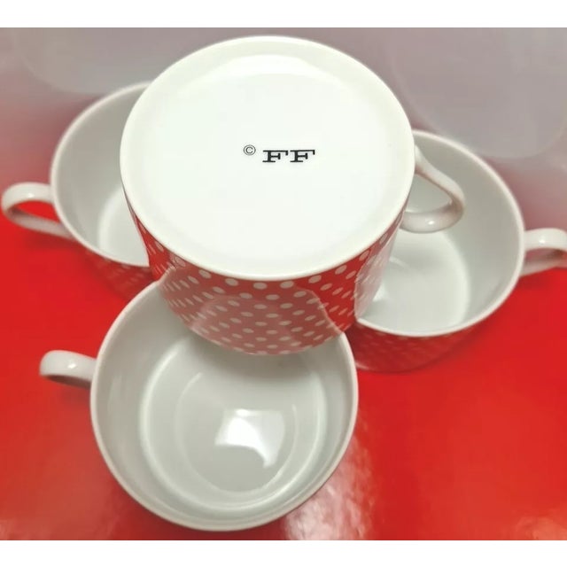 Add a playful yet sophisticated touch to your tableware with this set of 4 Fitz & Floyd Swiss Polka Dot Tea Cups....