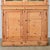 This tall English bookcase is perfect for a slender wall in need of storage and display. The top of the bookcase is...