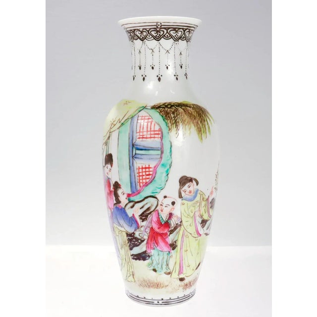 A fine Chinese Export porcelain vase. In a baluster form. Decorated with a painted scene of two men and two women in...