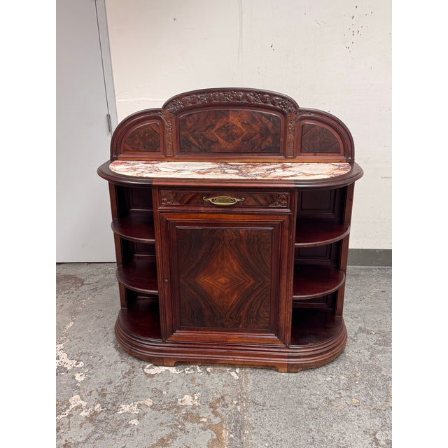 Design Plus Gallery presents an Art Nouveau Sideboard + Marble Top. This sideboard showcases an arched gallery back with...