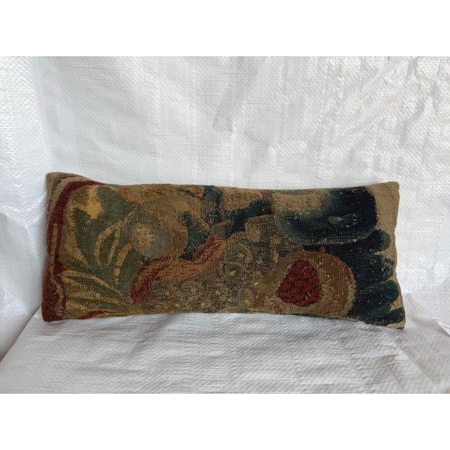 This exceptional 17th-century Flemish tapestry pillow is created from a historic woven tapestry fragment dating to the...