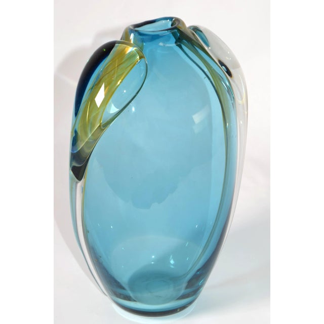 Artist Thomas Buechner III created this beautiful Studio Piece of Hot Blown Art Glass Vase in light Blue, Gold and...
