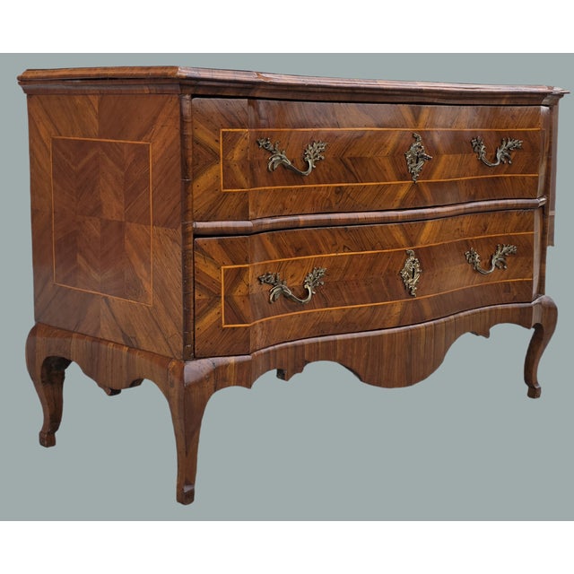 An important shaped two-drawer chest of drawers from the lower Veneto region, attributable to the Ferrara area, dating to...