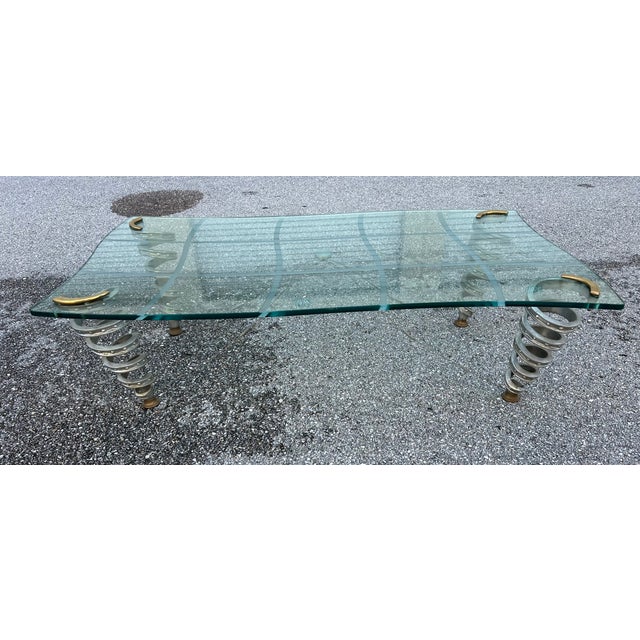 Stylish coffee table in thick glass, checker board pattern on glass , with shape glass .. Structural artistic element in...
