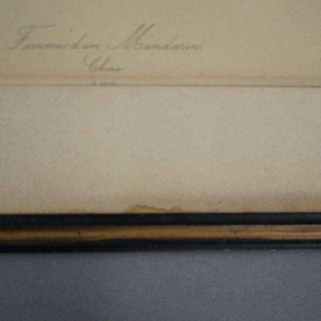 An antique set of hand colored portraits depict a man and woman in royalty garb, framed, signed as photographed, c1900....