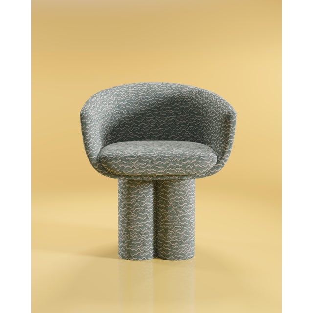 Evoking the gravity-defying curves and the legendary hourglass silhouette of Mae West, the Mae Dining Chair is an...