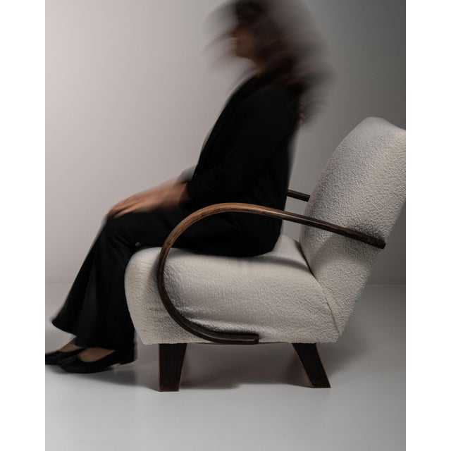 Upholstered bench with wool boucle top in Deep Espresso Brown. Finished in deep espresso brown, this upholstered bench...