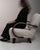 Upholstered bench with wool boucle top in Deep Espresso Brown. Finished in deep espresso brown, this upholstered bench...