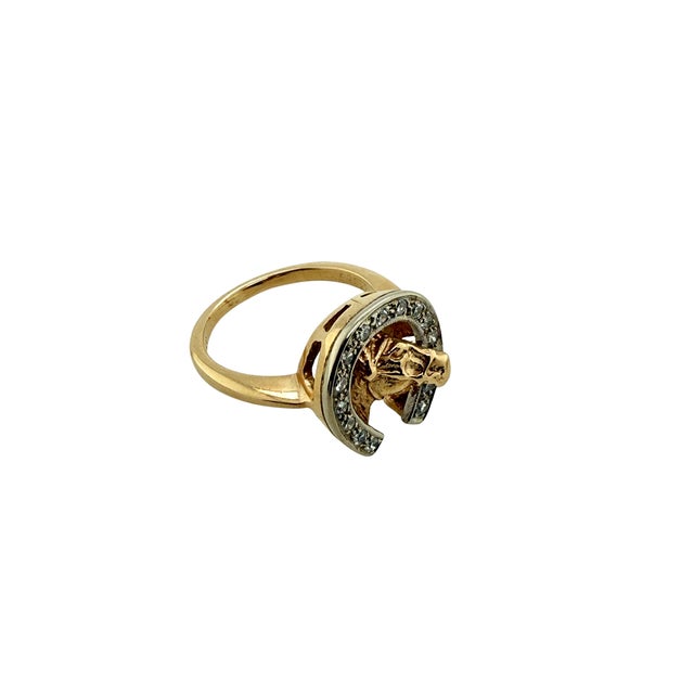 A mid-century figural ring that pairs the lucky horseshoe with a sculpted horse head, this 14K gold piece adds a little...