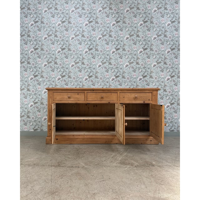 This large vintage sideboard in solid pine captivates with its clean lines, beautiful patina, and authentic charm. At...