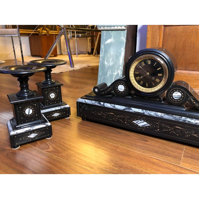 Up for sale is a very large antique clock garniture set. Included is a clock and its accompanying garniture side pieces....
