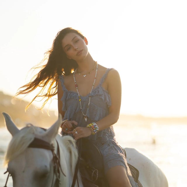 Celebrate love and joy with our Love in Bloom Charm Necklace. This playful design features a luminous heart, vibrant...