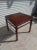 This Henredon side table is made of solid walnut. It's made in the chinoiserie ming style. It has hoofed feet and humpback...