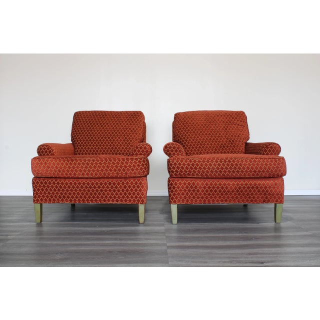 Vintage pair of upholstered club chairs These chairs are upholstered in a red chenille textile with diamond pattern...
