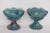 This lovely pair of candle holders are made of carnival glass. This set is made in the Harvest pattern used by Indiana...
