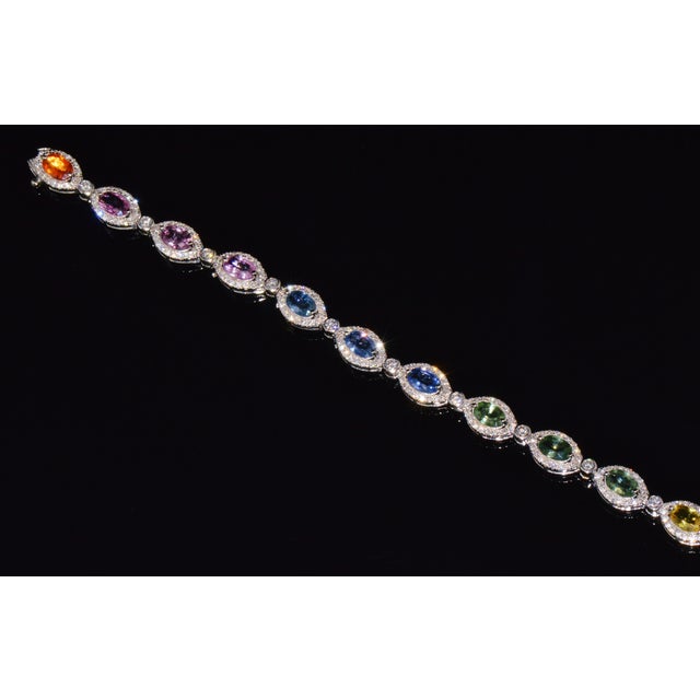 Gorgeous 18K solid gold 11.32CTS diamond and multi-color sapphire bracelet. This elegant designer stacking bracelet...