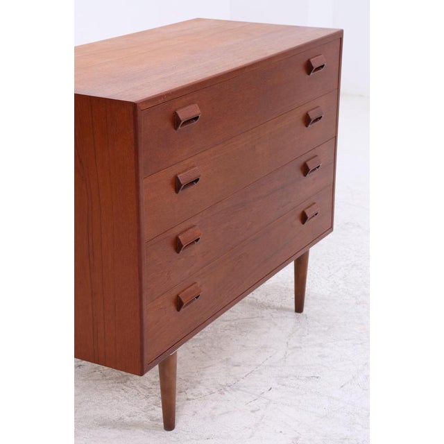 A timeless teak chest of drawers designed by Børge Mogensen, featuring clean lines and balanced proportions. Four spacious...