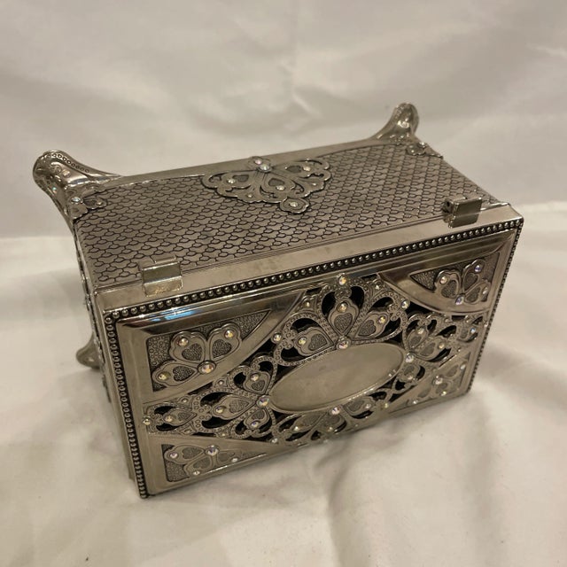 Beautiful jewelry dresser casket box in Silverplate with Swarovski crystals, wind up musical mechanism plays a tune....
