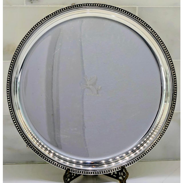 A striking vintage Prill Silver Co. round silver-plated gallery tray, measuring approximately 12 inches in diameter. This...