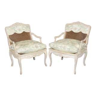 Pair Louis XV Style French Cream Distressed Painted Cane Back Armchairs For Sale