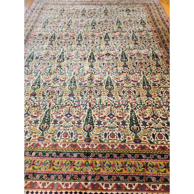 Early 20th-century Indian Agra room size rug featuring an allover “Tree of Life” pattern, inspired by the classical motifs...