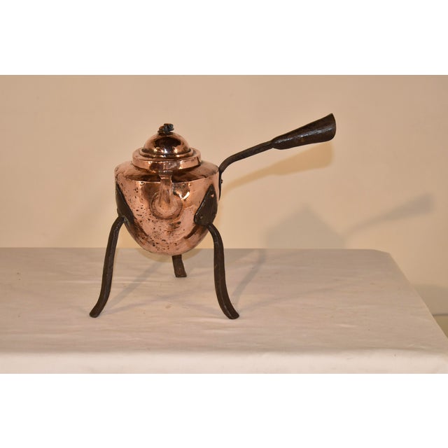 19th century hand forged copper kettle from Sweden with hand wrought iron legs and handle. This is a gorgeous piece of...