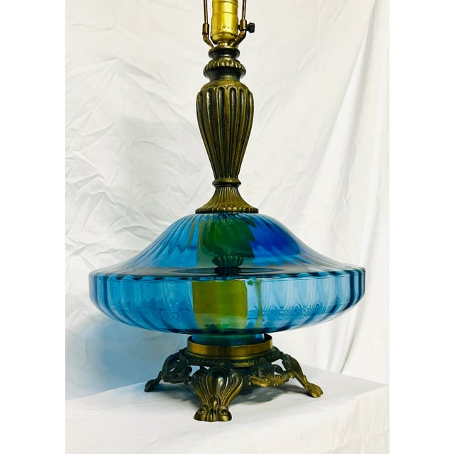 We love the contours of these wonderful handblown glass lamps with ornate brass feet. Elegant and graceful with a...