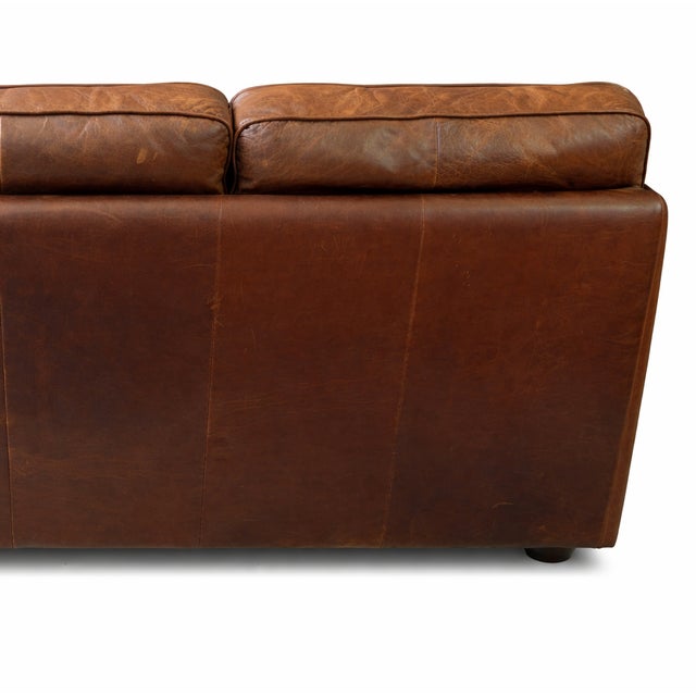 DESCRIPTION Authentic vintage brown leather sofa with deep, broken-in patina and classic rolled-arm proportions. This is...