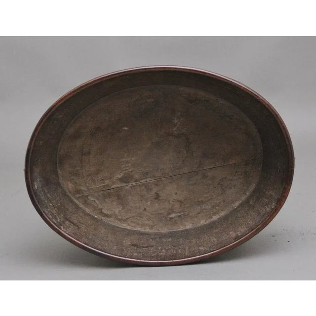 A lovely quality 18th Century mahogany and brass bound oval wine cooler, having brass lion head pull rings either side,...