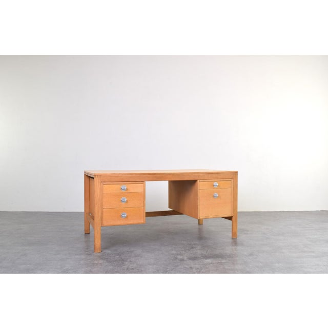 This Danish desk, designed by Chr. Rasmussen and manufactured by Randers Møbelfabrik, reflects the principles of mid-...