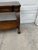 Vintage Neoclassical Revival Console Table With Ornately Carved Scroll Supports and Lower Shelf For Sale - Image 9 of 12