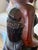 A striking vintage hand-carved East African hardwood sculpture depicting a mother carrying an infant on her back while...