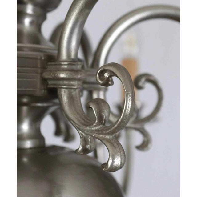 Six-arm chandelier decorated with fish and an eagle. The chandelier is made of white brass. Restored electrical...