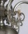 Six-arm chandelier decorated with fish and an eagle. The chandelier is made of white brass. Restored electrical...