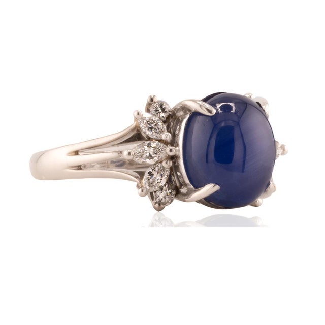Platinum Ring with 7.26 royal blue star sapphire and 6 marquis cut and 4 round brilliant cut dimaonds weighing 0.37...