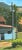 "View from Upstairs Porch, Nimrod Hall, Bath County, Virginia". This landscape oil painting is a view of the vegetable...