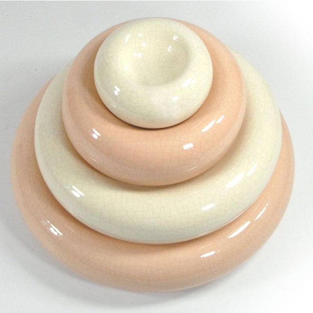 A postmodern decorative object and at the same time a set of practical table bowls made of glazed ceramics, decorated with...