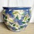 This vintage Chinese porcelain fishbowl showcases a richly hand-painted floral motif rendered in layered shades of cobalt...