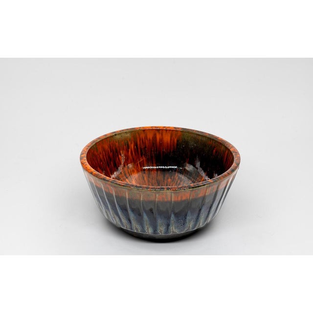 This exceptional bowl is a handcrafted work of art by the renowned Danish ceramicist Ernst Faxe. Made in the popular Fat...