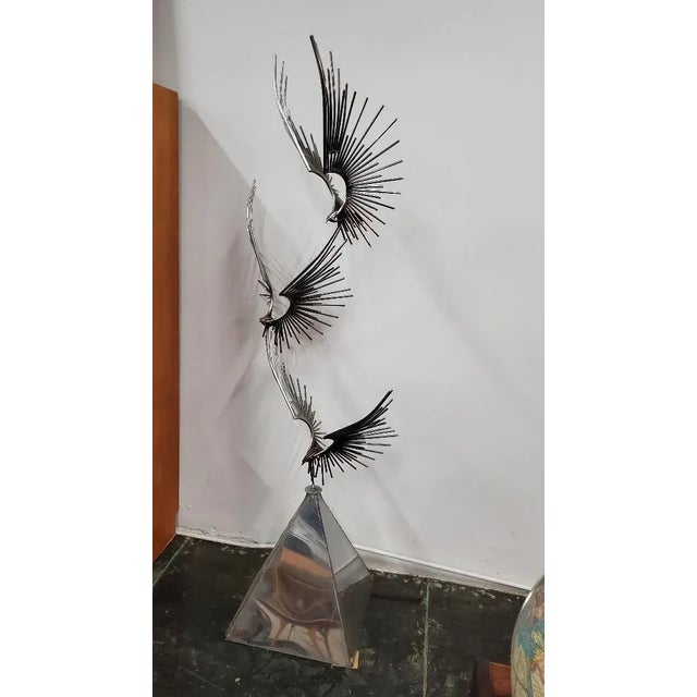 Curtis Jere "Birds At Flight" Chrome Metal Sculpture With A Trapezoidal Base. Three Chrome Metal Eagles At Flight. The...