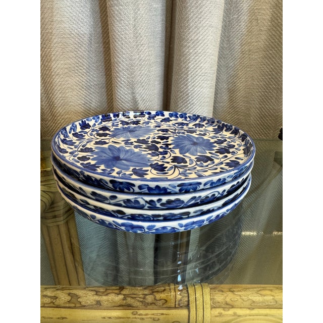 Set of four vintage beautifully hand painted in Royal blue and off white floral dessert/salad plates.