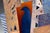 Layers of tall, arched and notched panels stand upright like a small village or a fan of buildings, in ochre, terracotta,...