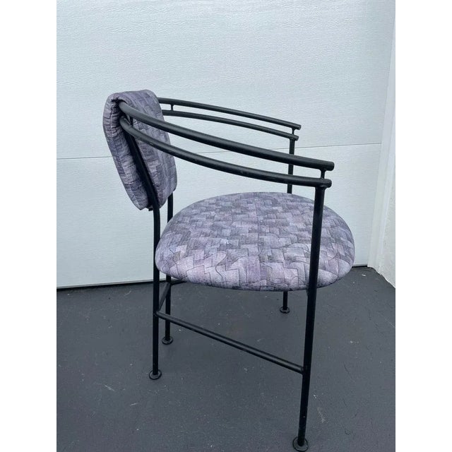 This is a great looking post modern Memphis style set of 4 chairs. They are curved black metal. The geometric upholstery...