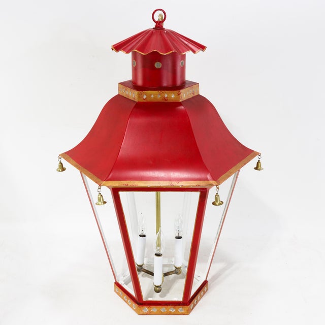 This striking vintage hanging lantern features a classic pagoda-inspired silhouette and is constructed from tole metal...