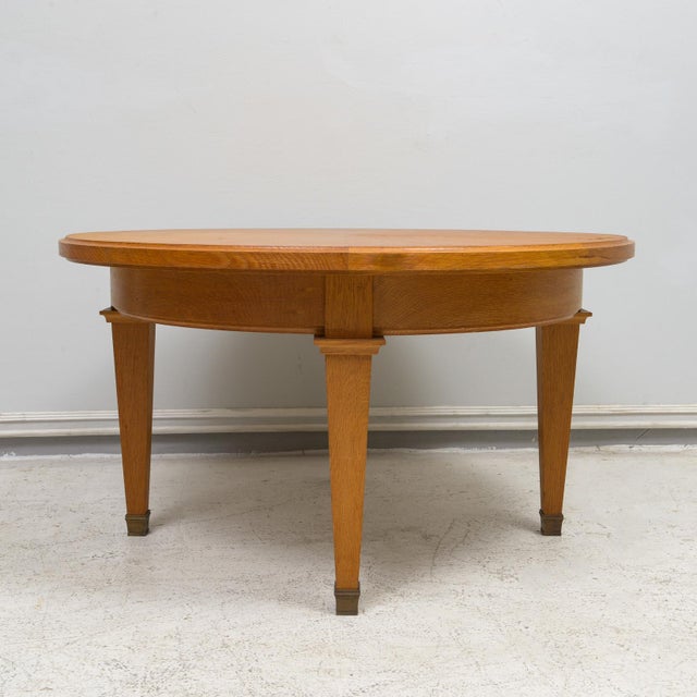Wood French Circular Coffee Table in Oak on Tapered Legs Ending in Brass Sabots For Sale - Image 7 of 7