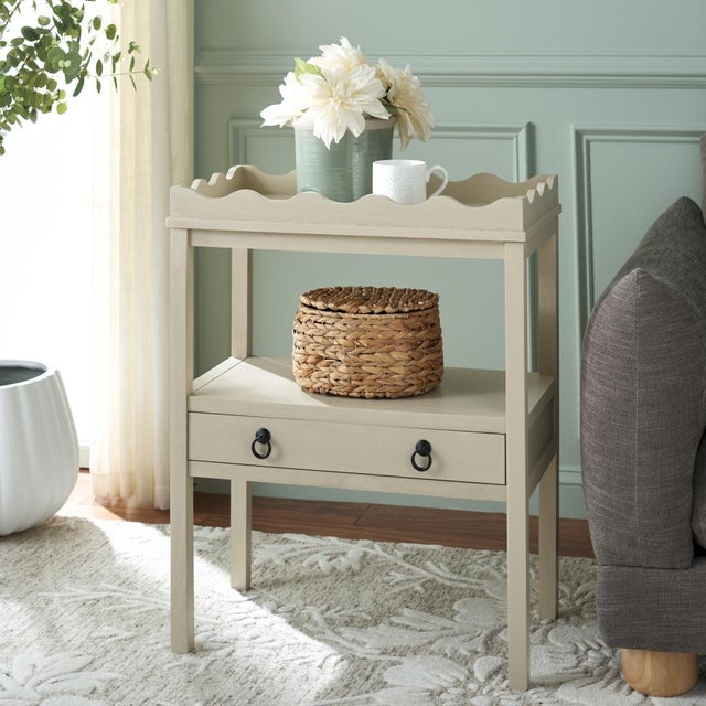 Enhance your space with the Darlyn Rectangle Accent Table in a soothing Sand hue. This versatile table features a clean...